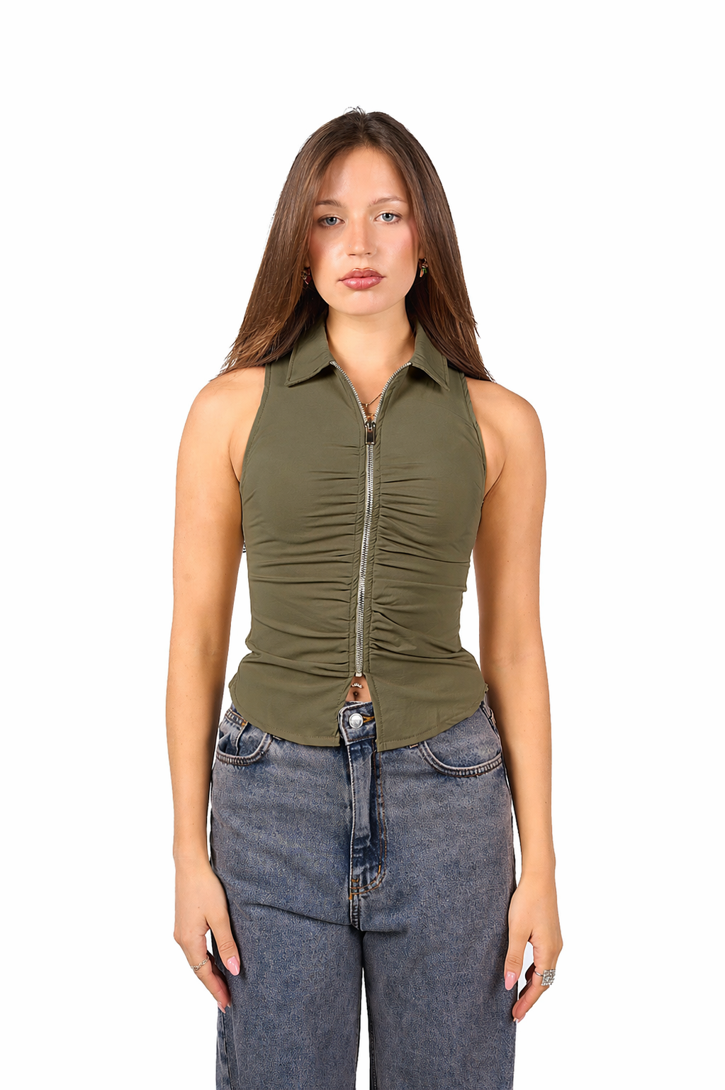Woman wearing a green sleeveless top with a zipper and blue jeans on a white background
