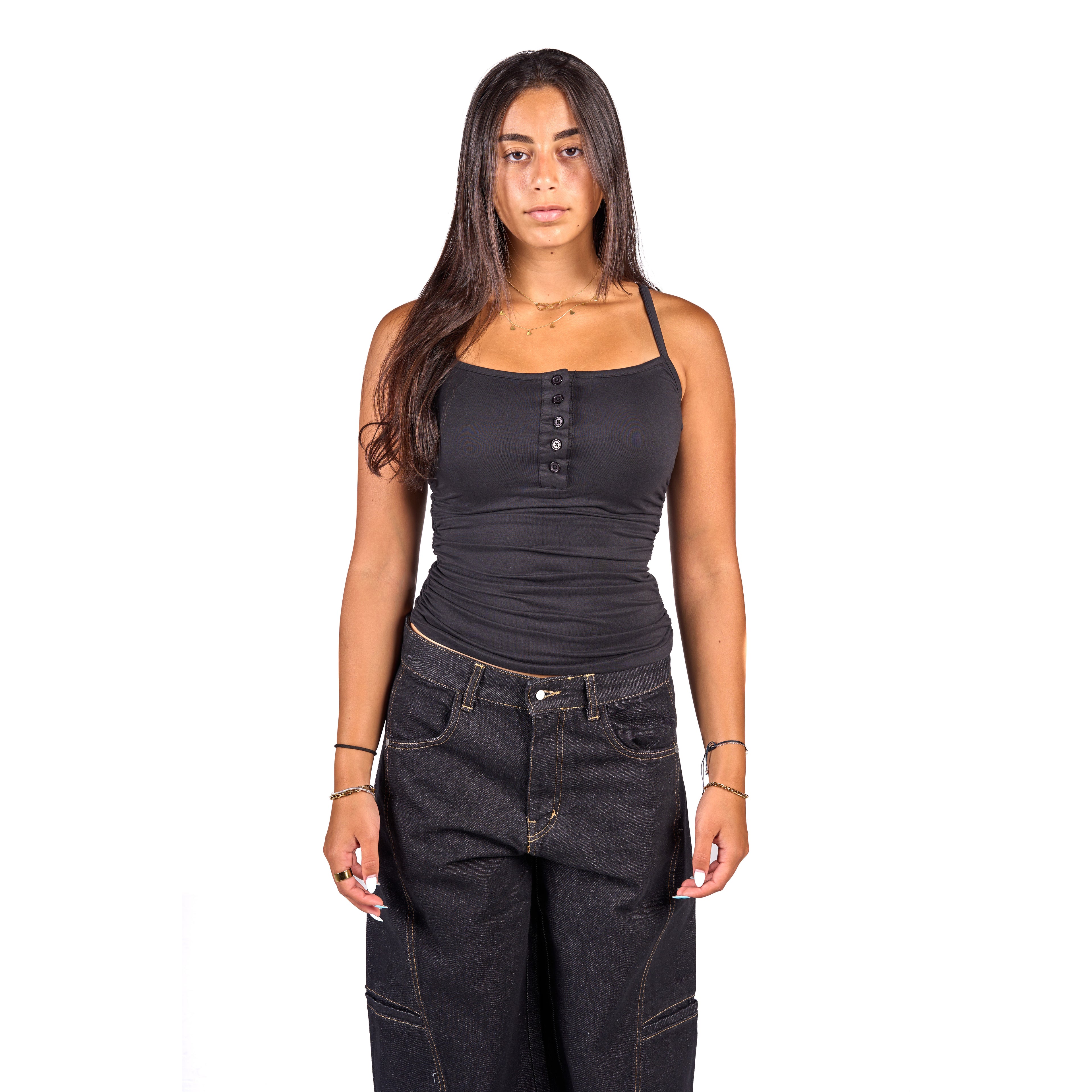 A woman modeling a black ribbed knit camisole top with a buttoned henley-style neckline, paired with dark washed jeans, against a plain white background.